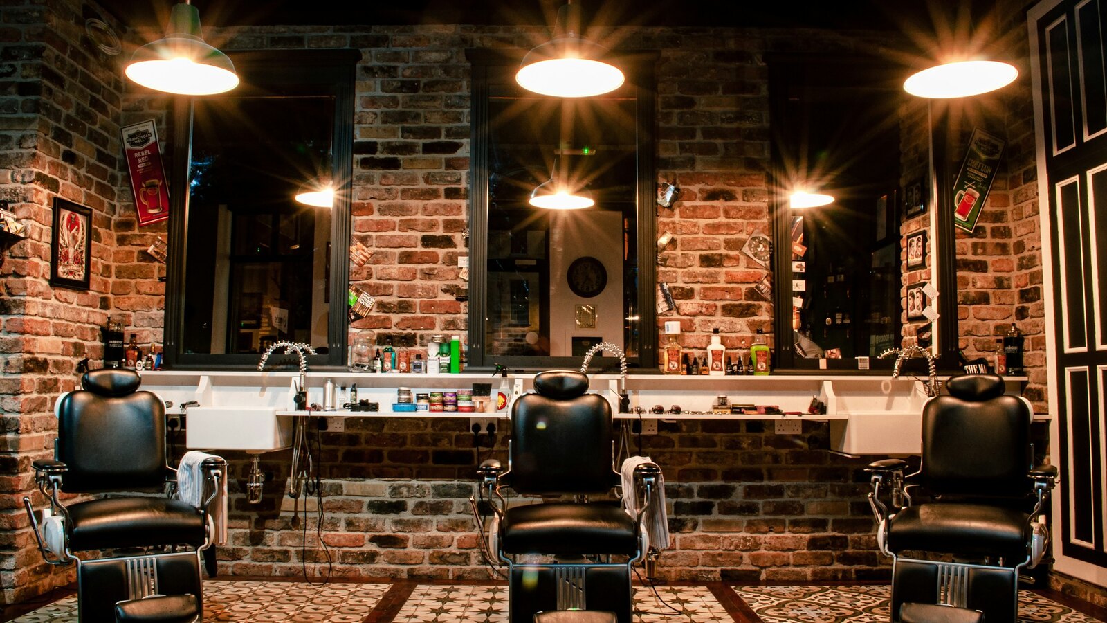Exposed brick and dark wood inside the barbershop